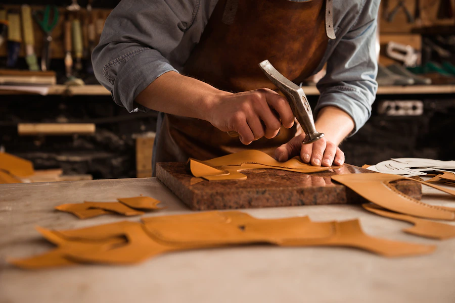 close up shoemaker man working with leather 171337 12285